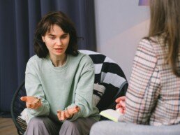 Female talking with psychologist during session