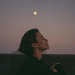 Woman relaxing at dusk